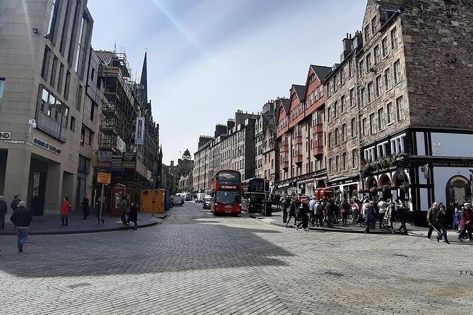 Curious Tales of the Royal Mile - Private Walking Tour - Canongate Kirk: Poets, Royal Favorites, and Eccentric Economists