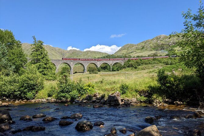 Private Harry Potter, Glenfinnan Viaduct, Highlands tour Glasgow - Commando Monument: Ben Nevis behind the bronze figures